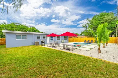 a small house with a patio and a pool at Modern & Cozy Private Pool Home in Parkway Regional Medical Center Heliport