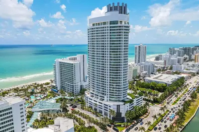 an aerial view of a tall building next to the ocean at FontaineBleau Suite at Miami Beach in Miami Beach