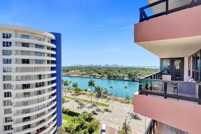 a view of a river between two buildings at Modern Ocean Escape Stylish 2BR Condo with Resort Amenities Pools Sauna and Gym 1417 in Miami Beach