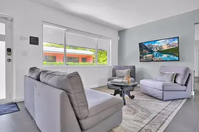 a living room with a couch and a chair at 175 Casa Buena Blanca in Miami