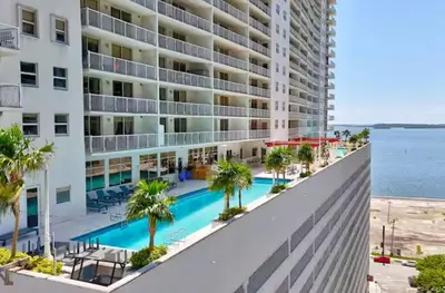 an aerial view of a large apartment building with a swimming pool at Central Unit in Heart of Brickell in Miami