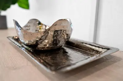 a pair of shoes sitting on a plate on a table at Relax & Fun Hollywood Private Pool | Arcade Game in Hollywood