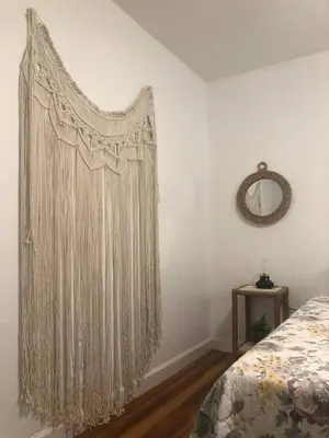 a bedroom with a curtain hanging on a wall at 2 Bedroom Apartment Free Reserved Parking in Miami