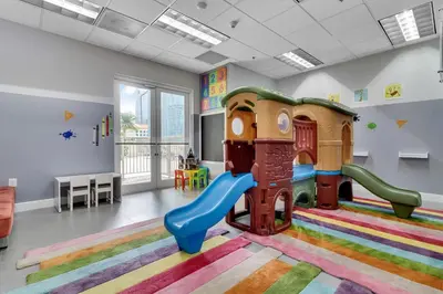 a childrens play room with a slide at Elegant 1 BR Retreat in Brickell With Free Parking in Miami