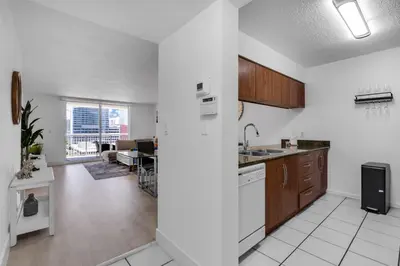 a kitchen and living room with a view of a living room at Elegant 1 BR Retreat in Brickell With Free Parking in Miami