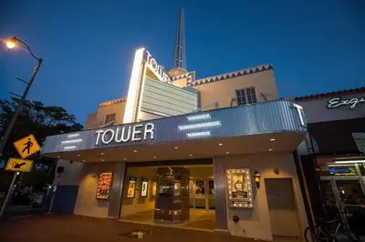 a theater with a tower on top of a building at Apartment in the Heart of Calle 8 with Parking in Miami
