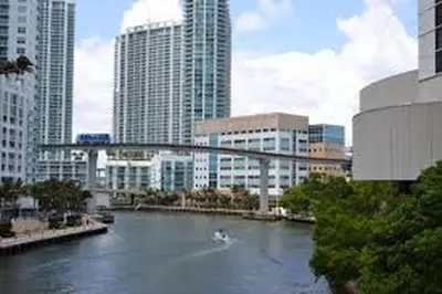 a bridge over a river in a city with buildings at Unique Studio in Little Havana Reserved Parking in Miami