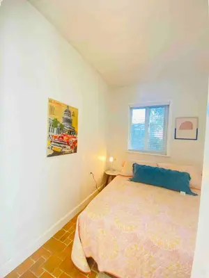 a bedroom with a bed and a window at 3 Bedroom Apartment with Backyard Oasis in Miami