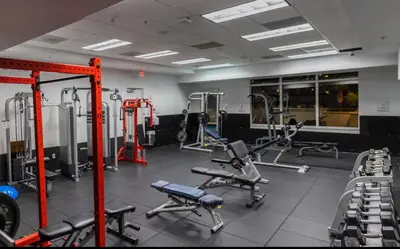 a gym with several treadmills and exercise machines at Brickell 1 Bed 1 Bath Free Parking in Miami