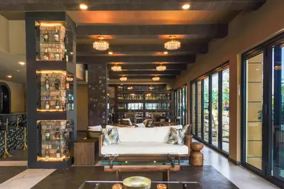 a room with a white couch and some windows at Barley House Hotel, Trademark Collection by Wyndham in Fort Lauderdale
