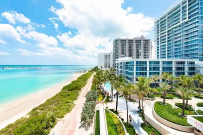 a view of the beach and buildings and the ocean at Carillon Miami Beach Private Luxury Suites in Miami Beach
