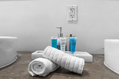 a roll of toilet paper sitting next to a sink at Brickell Nights, Icon Lights 1BR Luxe Stay in Miami