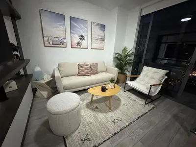 a living room with a couch and a table at Luxury Downtown Miami Stay in Upscale Building in Miami