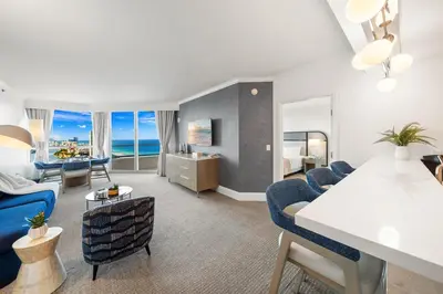 a living room with a couch and a table at Ocean View Private Residence at Fontainebleau -3505 in Miami Beach