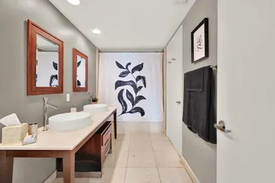 a bathroom with two sinks and a shower at Luxurious 5-STAR condo at the ICON Brickell in Miami