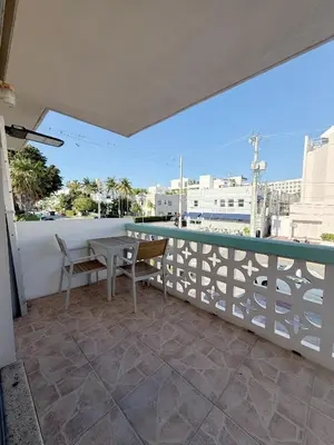 a balcony with a table and chairs and a view at SeaStays- South Beach Apartments in Miami Beach