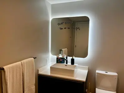 a bathroom with a sink and a mirror at The Art Studio Downtown in Miami