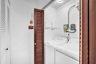 a bathroom with two sinks and a mirror at Lime Haus lime - Your Family Stay in Miami Awaits in Tamiami