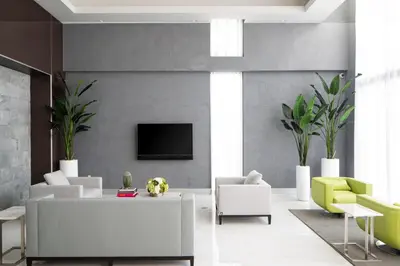 a living room with a couch and a tv on a wall at Blueground Riverside pool AC nr parks MIA-144 in Miami