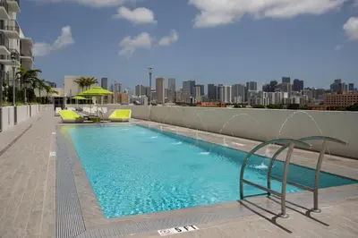 a swimming pool on the roof of a building at Blueground Riverside pool AC nr parks MIA-144 in Miami