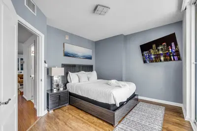a bedroom with blue walls and a bed in a room at City-View Retreat in Brickell 2BR and Free Parking in Miami