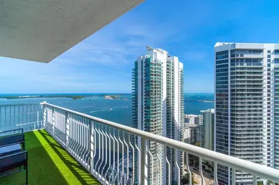 a balcony with a view of the ocean and buildings at City-View Retreat in Brickell 2BR and Free Parking in Miami