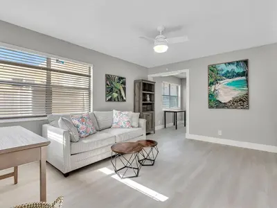 a living room with a couch and a table at Dania Beach 1BR | Views + WiFi + Parking in Dania Beach