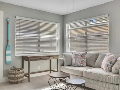 a living room with a couch and a table at Dania Beach 1BR | Views + WiFi + Parking in Dania Beach