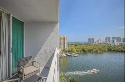 a balcony with a view of a river at Modern Condo by the Beach, Water Taxi Stop, Prime Location! in Fort Lauderdale