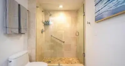 a bathroom with a shower and a toilet at Modern Condo by the Beach, Water Taxi Stop, Prime Location! in Fort Lauderdale