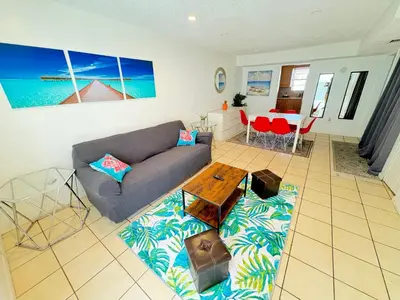 a living room with a couch and a table at South Beach and Collins, Parking included in Miami Beach