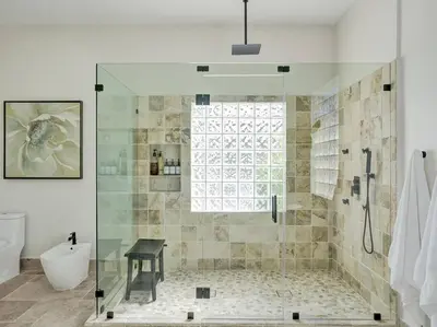 a bathroom with a shower with a glass door at Villa Riverland in Fort Lauderdale