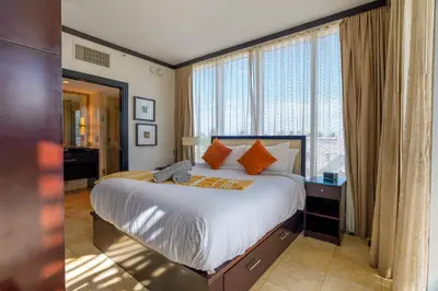 a bedroom with a bed and a large window at Penthouse with Private Rooftop in Miami Beach