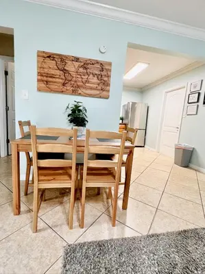 a dining room and kitchen with a table and chairs at Fort Lauderdale Florida Beach Vibe Hangout in Fort Lauderdale