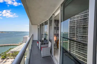 a balcony of a building with a view of the ocean at Luxury Unit 1 Bed W Residences Brickell in Miami