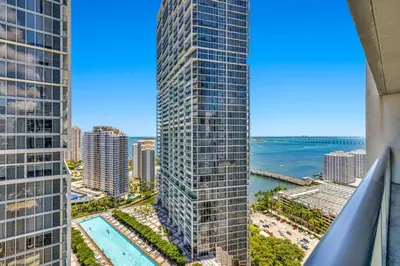 an aerial view of a tall building with a pool at Luxury Unit 1 Bed W Residences Brickell in Miami