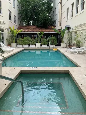 a swimming pool in the middle of a building at Pool and Jacuzzi. Walk to beach, South Point Pier in Miami Beach