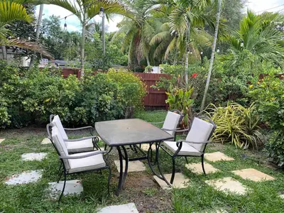 a table and two chairs and a table and chairs at 2 Bedroom Cozy House Near Barry University in Miami