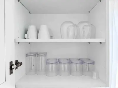 a shelf with jars and vases in a kitchen at Center Miami Designer Home 3 BR sleeps 9 in Miami