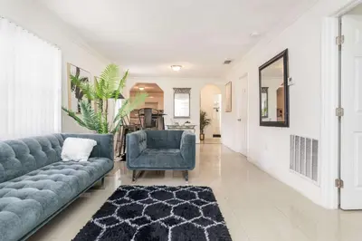 a living room with a couch and a chair at Charming 3BR Getaway - Central Miami Location in Miami