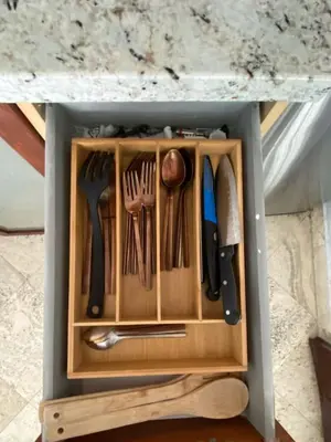 a drawer with utensils in it under a table at Right on the Beach Ocean Dr Secured Condo 206 in Miami Beach