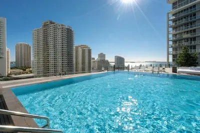 a large swimming pool on the roof of a building at W Hotel 2BR Ocean View, Pool, Spa, Free Gym Classes in Miami