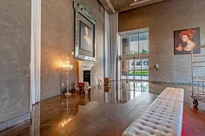 a living room with a couch and a fireplace at W Hotel 2BR Ocean View, Pool, Spa, Free Gym Classes in Miami