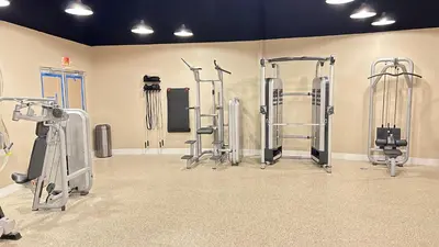 a gym with several exercise equipment in a room at Shine Suites Balcony Duplex 11 in Miami Beach