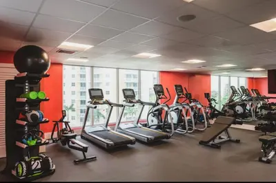 a gym with a bunch of exercise bikes in a room at 2Bedroom 2 Bath condo 10 Mins Walking To Jackson Memorial Hospital in Miami