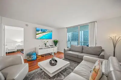 a living room with a couch and a table at Skyline and Bay Glimpse 1BR Brickell Retreat in Miami