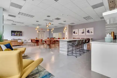 a restaurant with chairs and a bar in a room at Skyline and Bay Glimpse 1BR Brickell Retreat in Miami