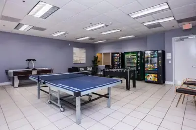 a room with a ping pong table in it at Elegant 1BR Condo at Brickell in Miami