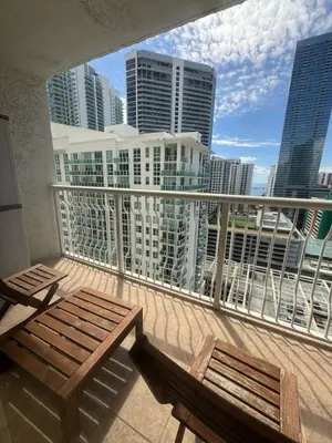 a balcony with benches and a view of the city at Elegant 1BR Condo at Brickell in Miami