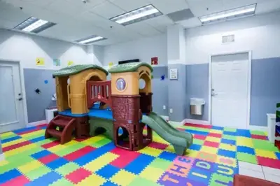 a childs play room with a playground at Cozy 2BR Apt at Brickell free parking in Miami